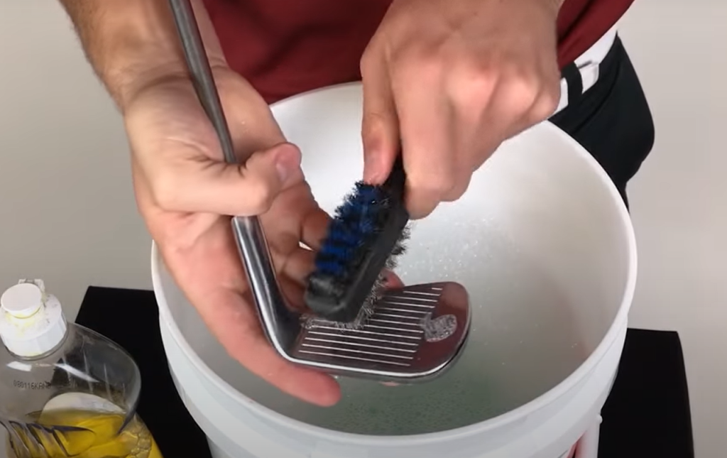 Remove dirt and grime from golf iron head